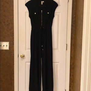 Jumpsuit black color with gold zipper and buttons